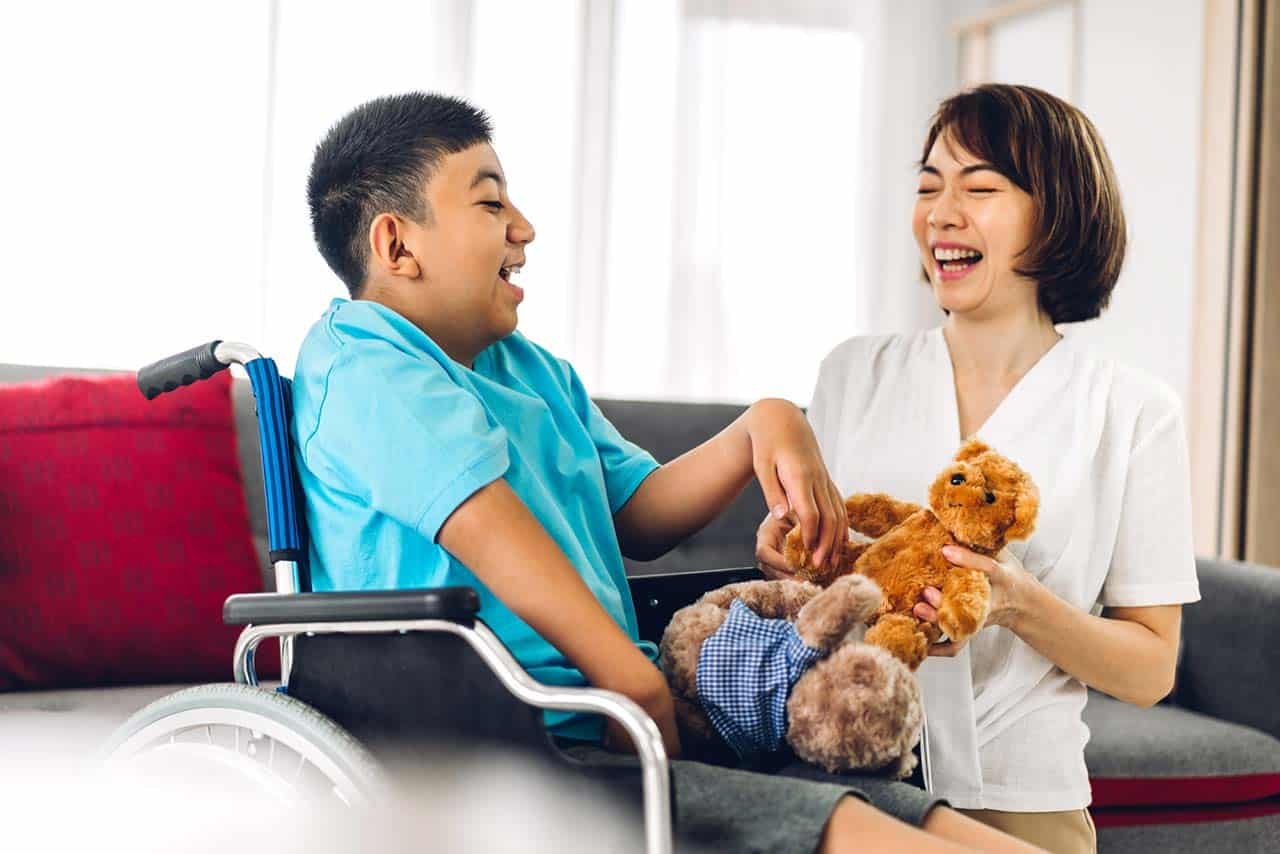 Image of a support worker gently assisting a client with personal grooming or dressing