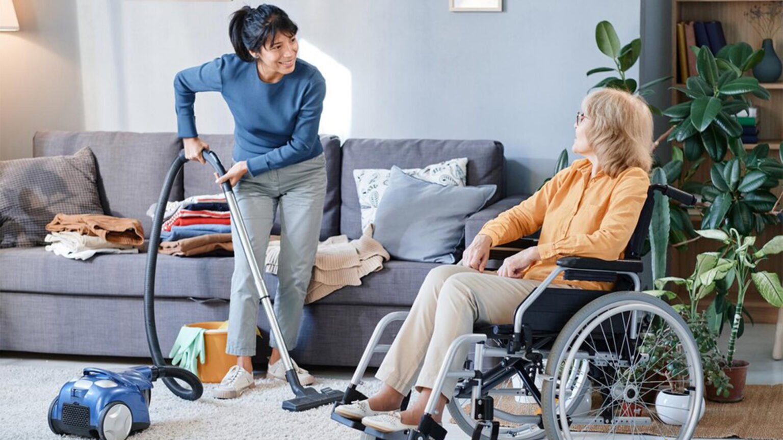 Image depicting a support worker providing care to a client in a home setting, possibly at night