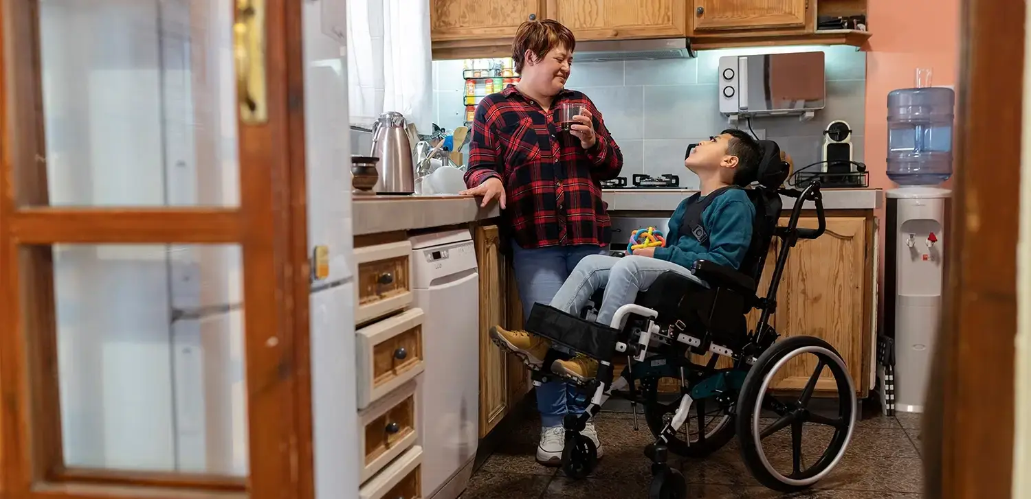 Image depicting a support worker assisting a client with positive behavior strategies